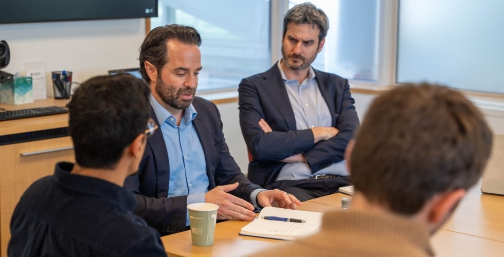 Photo featuring Jake Cusack and Tom Flahive in a conversation on development finance ata Harvard Business School