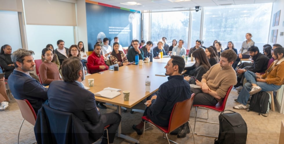 Photo featuring Jake Cusack and Tom Flahive in a conversation on development finance ata Harvard Business School